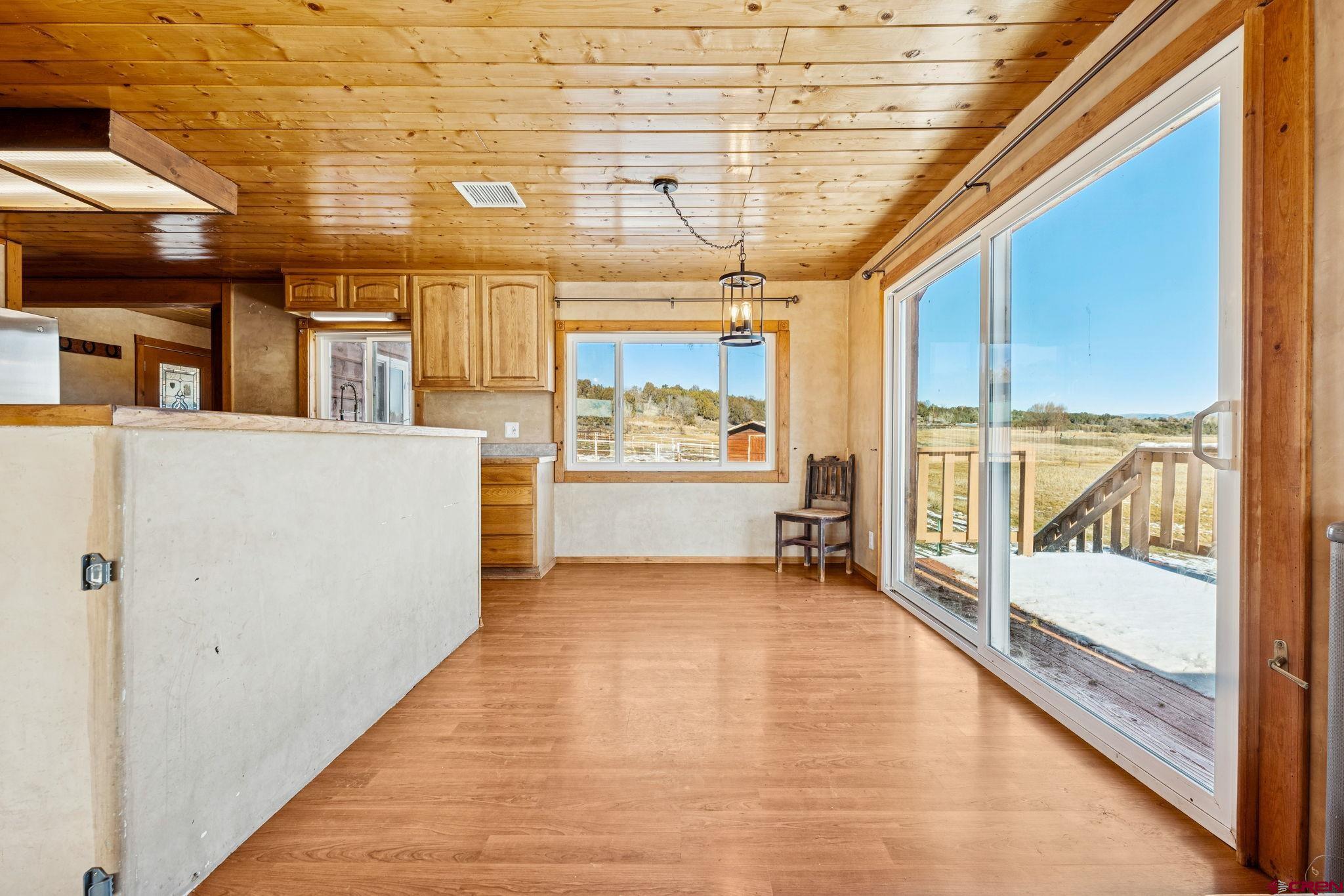 124 Meadow Road Ignacio, CO 81137 - Photo 26 of 37 a view of a room with wooden floor and iron stairs