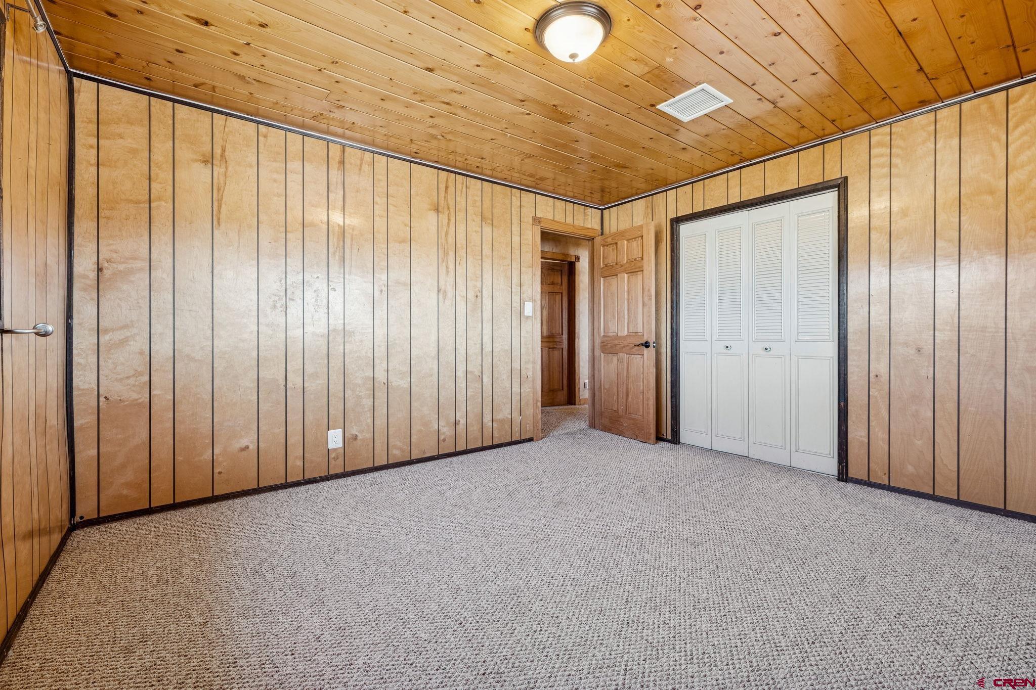 124 Meadow Road Ignacio, CO 81137 - Photo 31 of 37 a view of a big room with wooden walls
