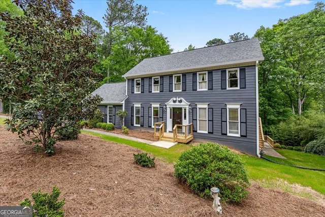 a aerial view of a house with swimming pool and porch