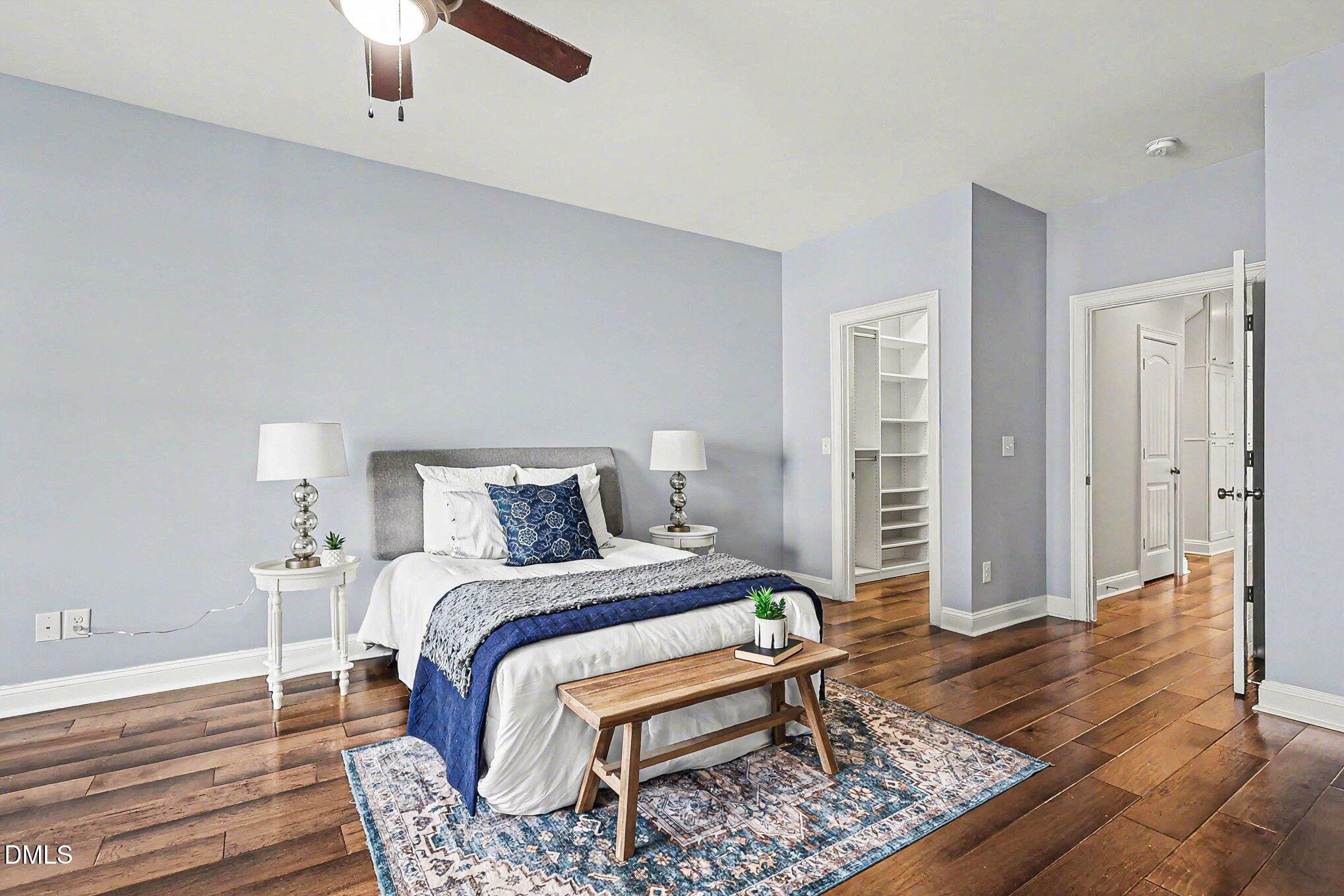 653 Fallon Grove Way Raleigh, NC 27608 - Photo 21 of 38 a bedroom with a bed and a walk in closet