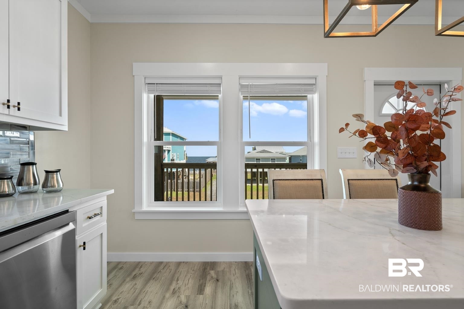 2586 Muscogee Road Gulf Shores, AL 36542 - Photo 14 of 55 Dining area featuring light wood-type flooring and ornamental molding