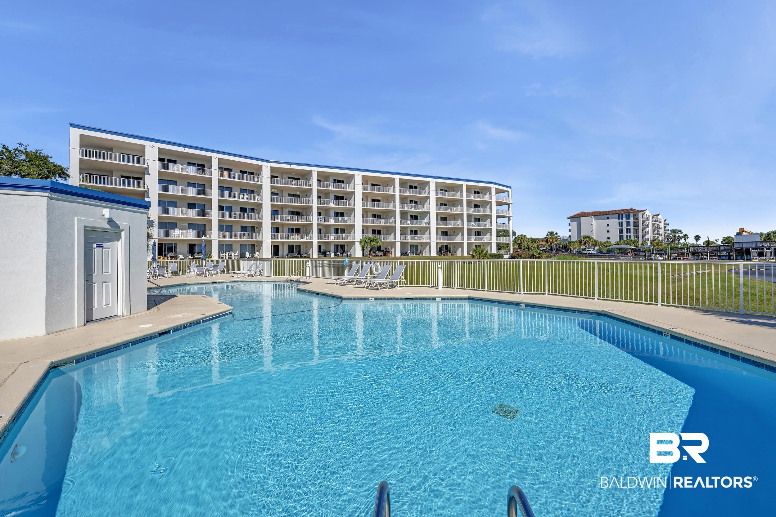 27282 Canal Road, Unit 104 Orange Beach, AL 36561 - Photo 5 of 79 Community pool featuring a patio area