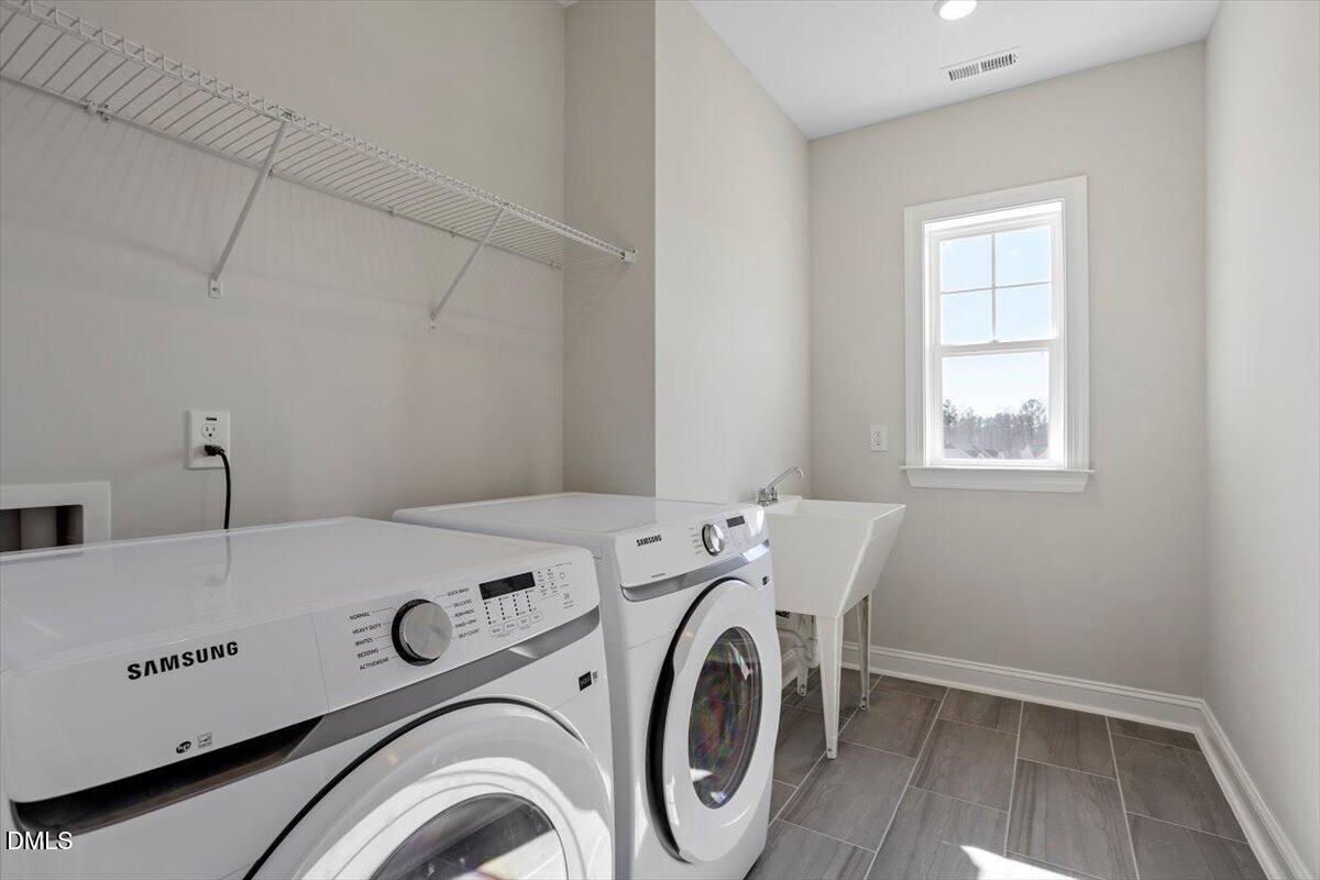 137 Moraine Court Raleigh, NC 27610 - Photo 28 of 40 Laundry Room w/ Sink