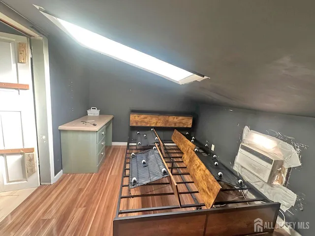 a view of a living room with furniture and a flat screen tv