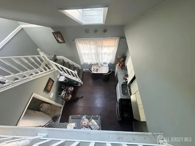 a view of living room with furniture and a window