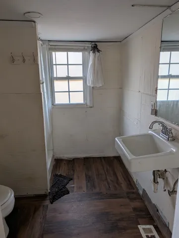 a bathroom with a sink toilet and tub