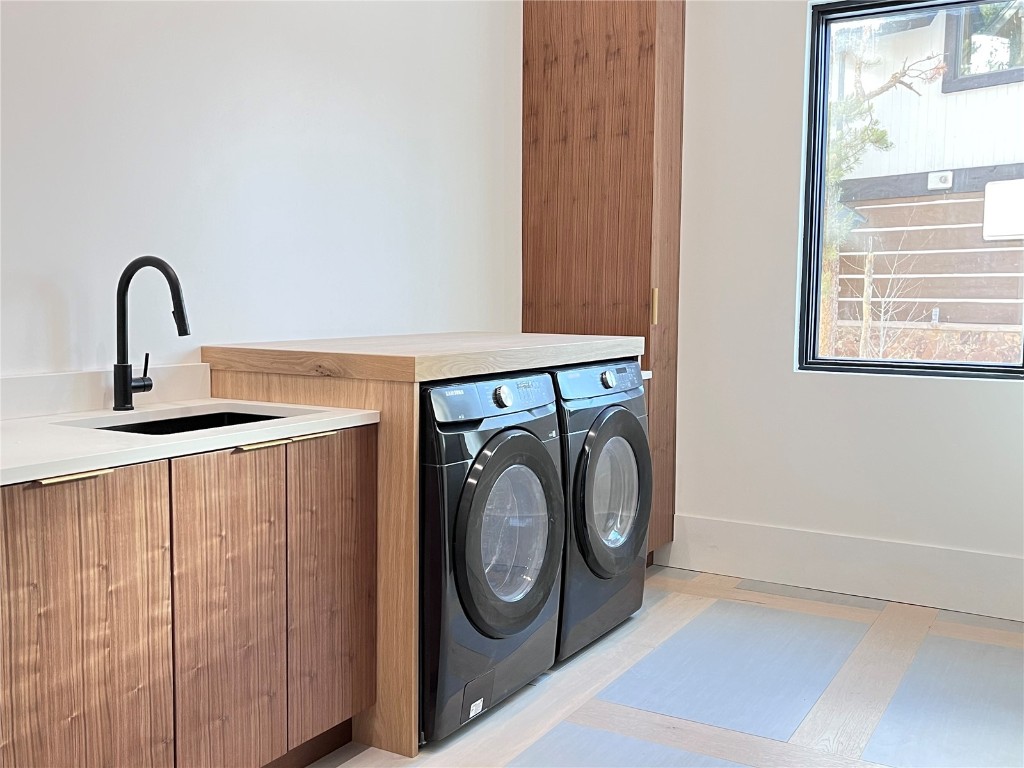 16 Wolf Rock Road Keystone, CO 80435 - Photo 31 of 40 a utility room with dryer and washer