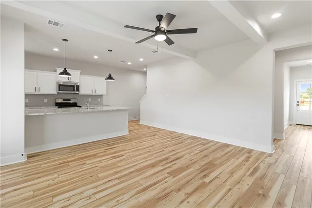 a view of a house with backyard and garden