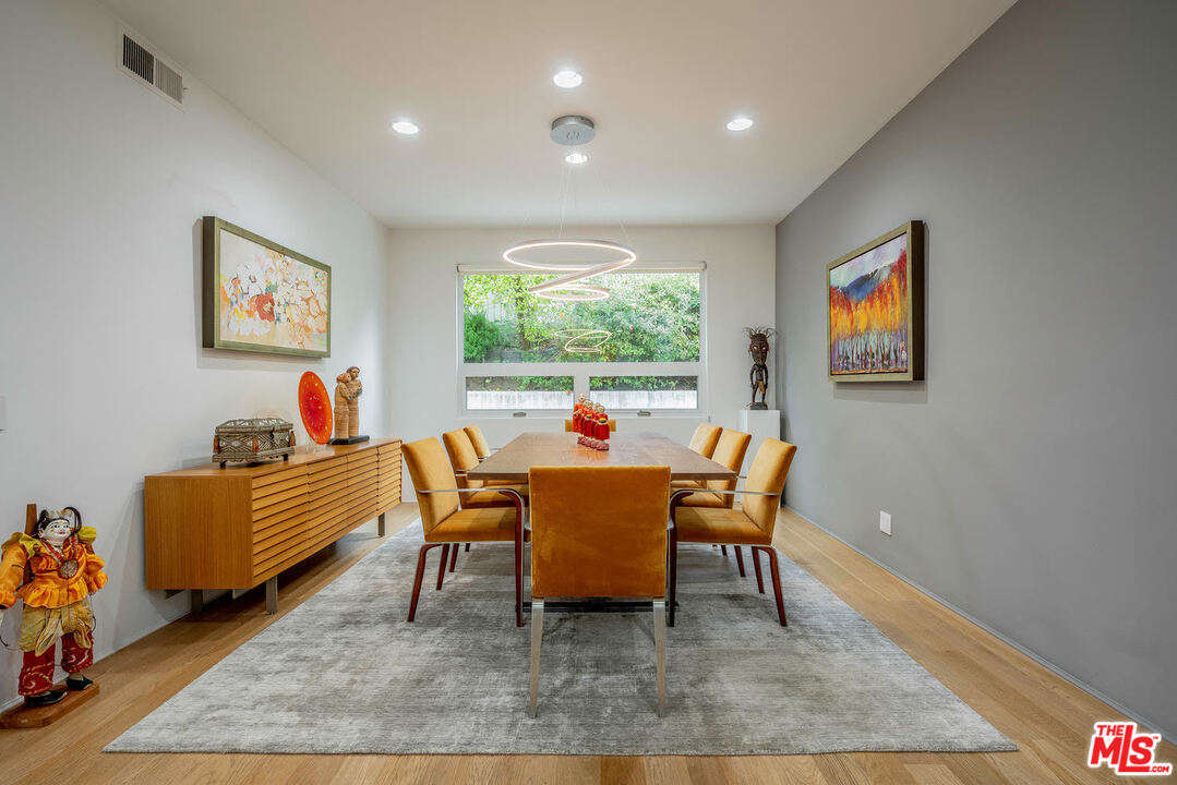 24050 Park Casino Calabasas, CA 91302 - Photo 12 of 43 a dining room with wooden floor and a rug