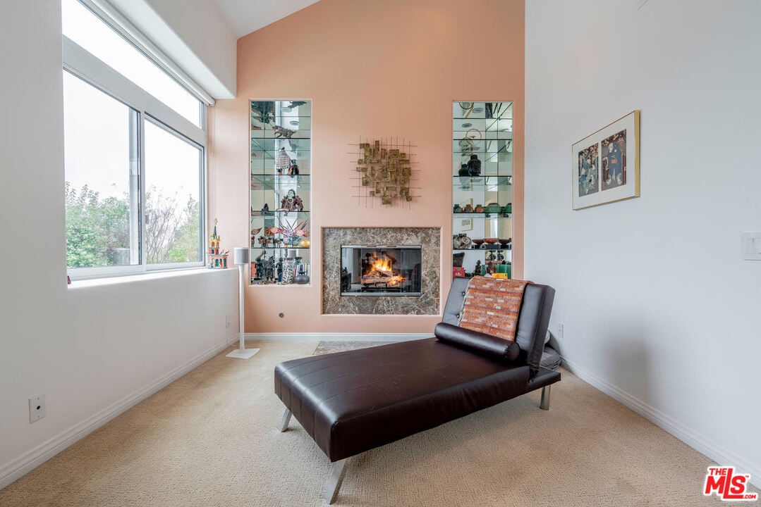 24050 Park Casino Calabasas, CA 91302 - Photo 29 of 43 a living room with furniture and a fireplace