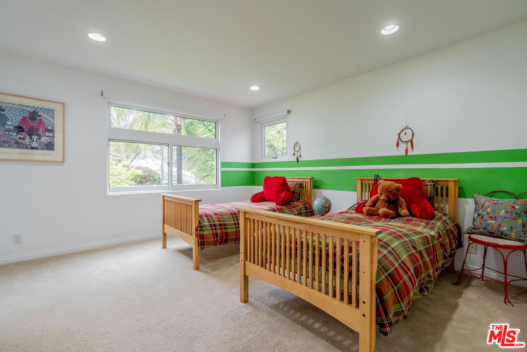 24050 Park Casino Calabasas, CA 91302 - Photo 37 of 43 a bedroom with three beds and a crib