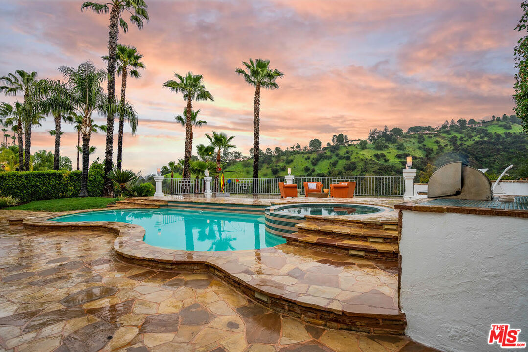 24050 Park Casino Calabasas, CA 91302 - Photo 38 of 43 a view of swimming pool with a table and chair