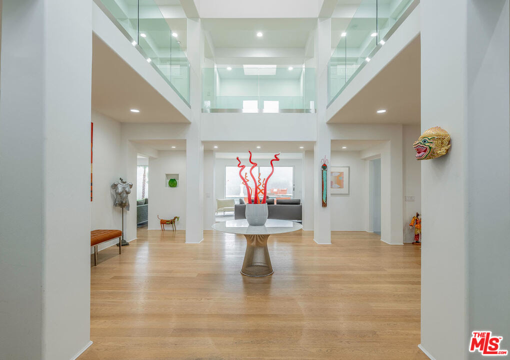 24050 Park Casino Calabasas, CA 91302 - Photo 6 of 43 a view of a hallway with wooden floor and staircase