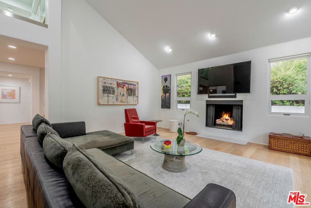 24050 Park Casino Calabasas, CA 91302 - Photo 9 of 43 a living room with furniture a flat screen tv and a fireplace