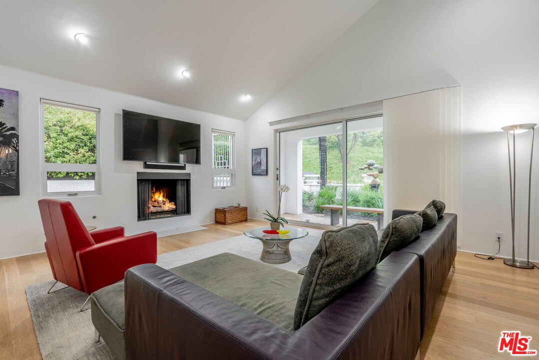 24050 Park Casino Calabasas, CA 91302 - Photo 10 of 43 a living room with furniture a flat screen tv and a fireplace