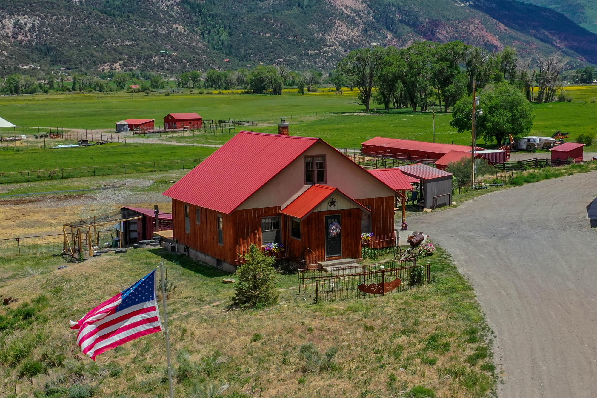 5276 County Road 23 Ridgway, CO 81432 - Photo 22 of 33 a backyard of a house with outdoor seating and green space