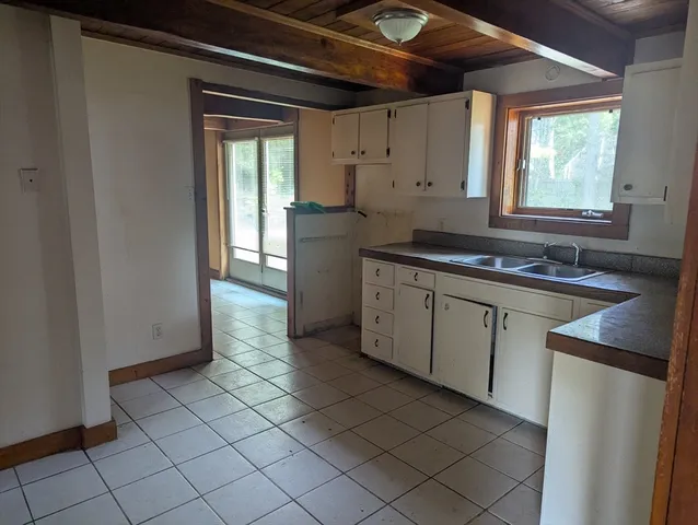 a kitchen with a sink and cabinets