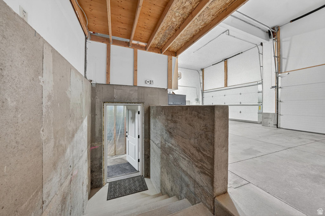 14738 Tangle Hill Road Herriman, UT 84096 - Photo 54 of 66 Spacious unfinished basement with concrete walls and exposed wood ceiling joists