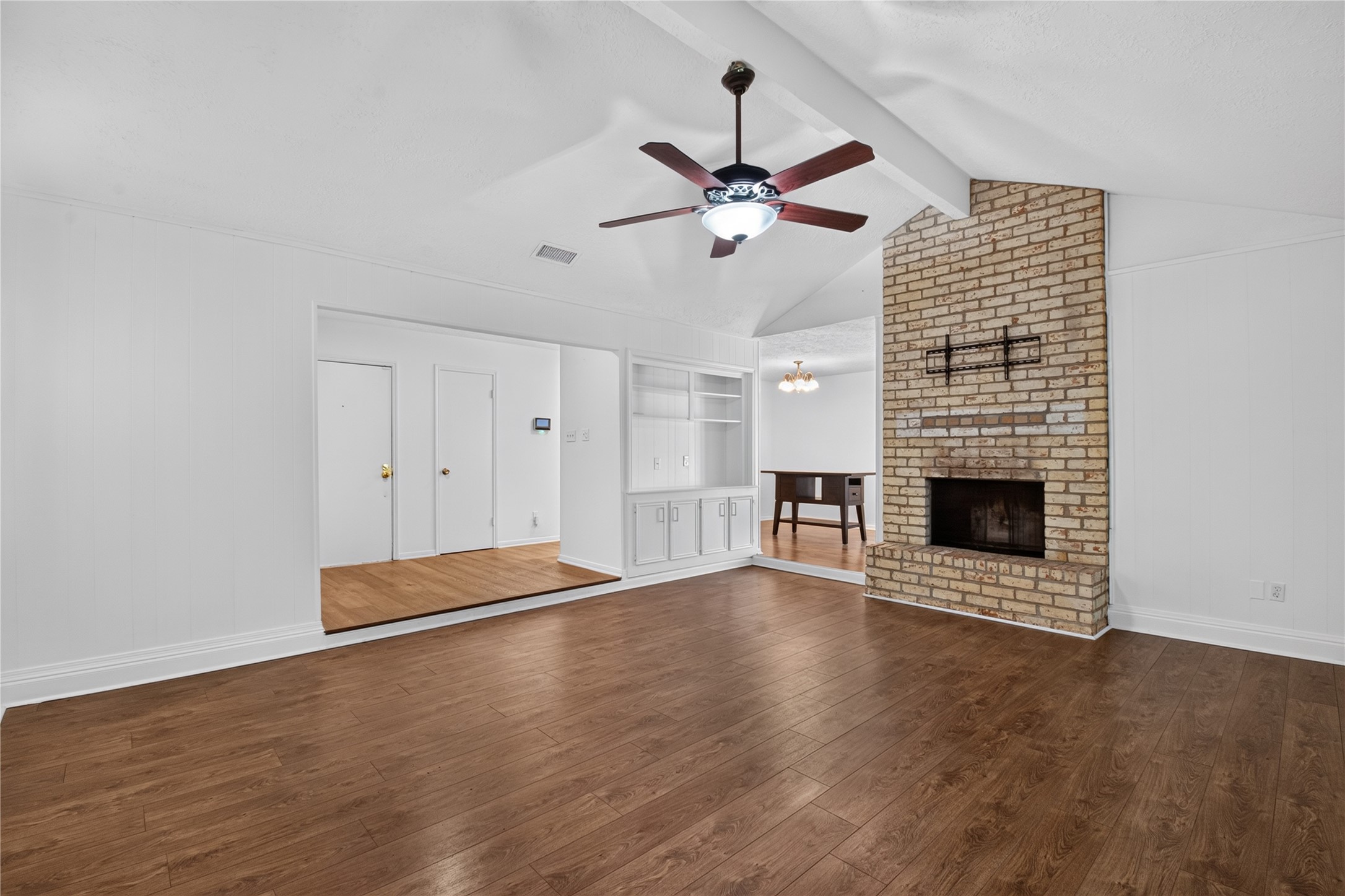 25223 Lynbriar Lane Spring, TX 77373 - Photo 6 of 32 This spacious family room offers soaring ceilings, a timeless brick fireplace, built-in cabinetry, and an open flow to the adjoining dining area