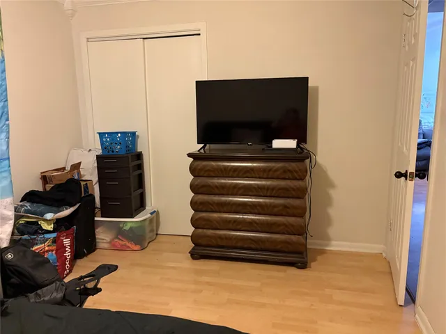 a view of a livingroom with furniture and a flat screen tv