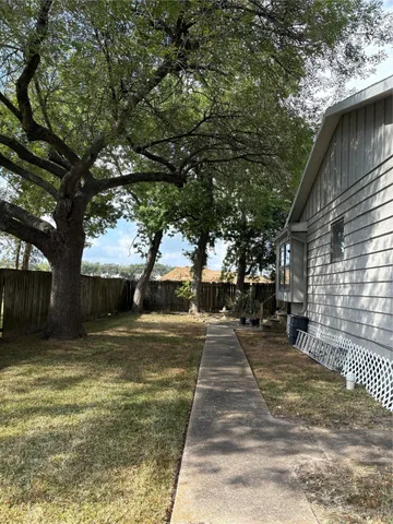 a view of a yard with an tree