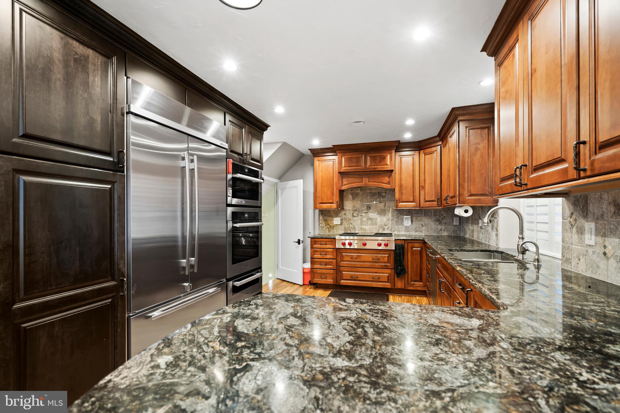 1028 Foss Avenue Drexel Hill, PA 19026 - Photo 12 of 48 a kitchen with stainless steel appliances granite countertop a refrigerator and a stove