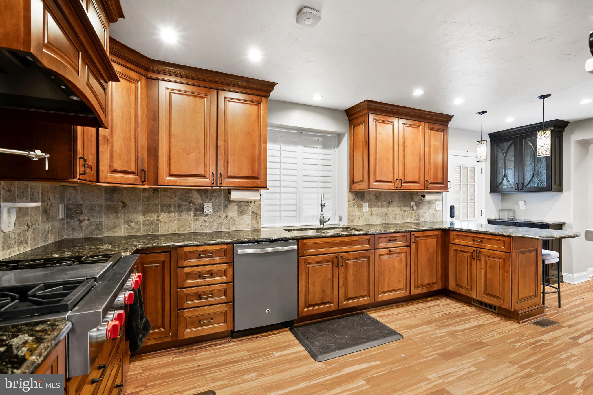 1028 Foss Avenue Drexel Hill, PA 19026 - Photo 13 of 48 a kitchen with stainless steel appliances granite countertop wooden cabinets a stove top oven a sink and dishwasher