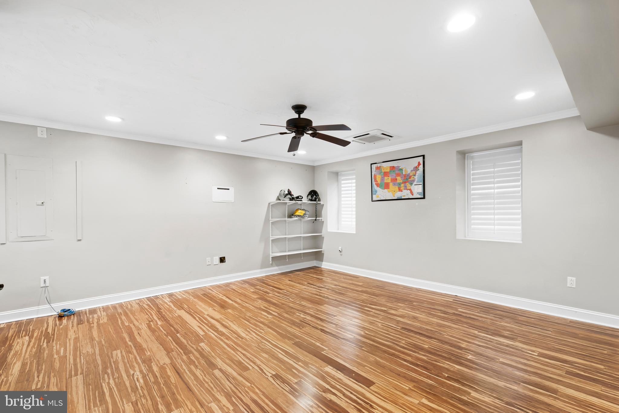 1028 Foss Avenue Drexel Hill, PA 19026 - Photo 15 of 48 a view of empty room with wooden floor and fan