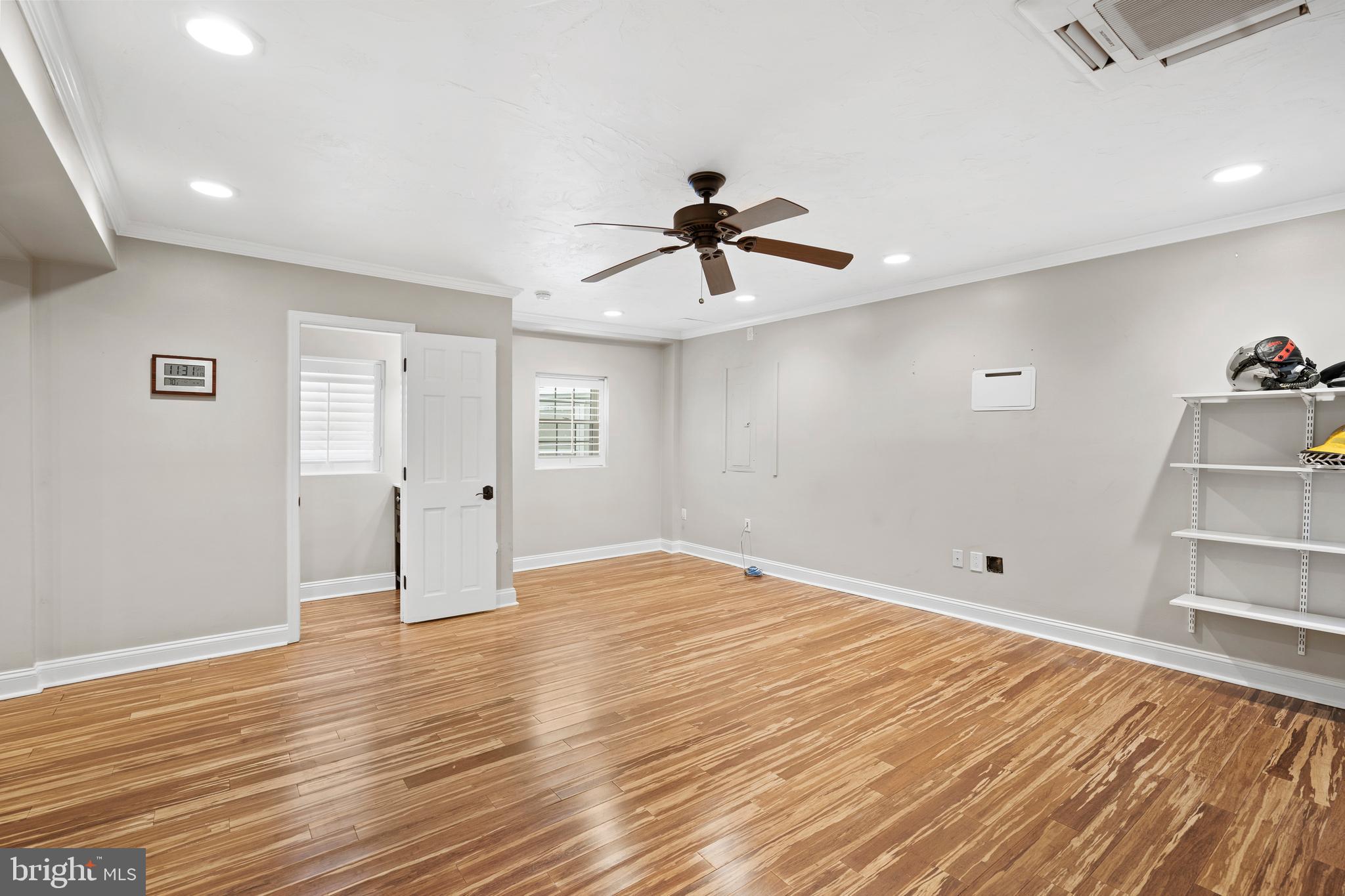 1028 Foss Avenue Drexel Hill, PA 19026 - Photo 16 of 48 a view of empty room with wooden floor and fan