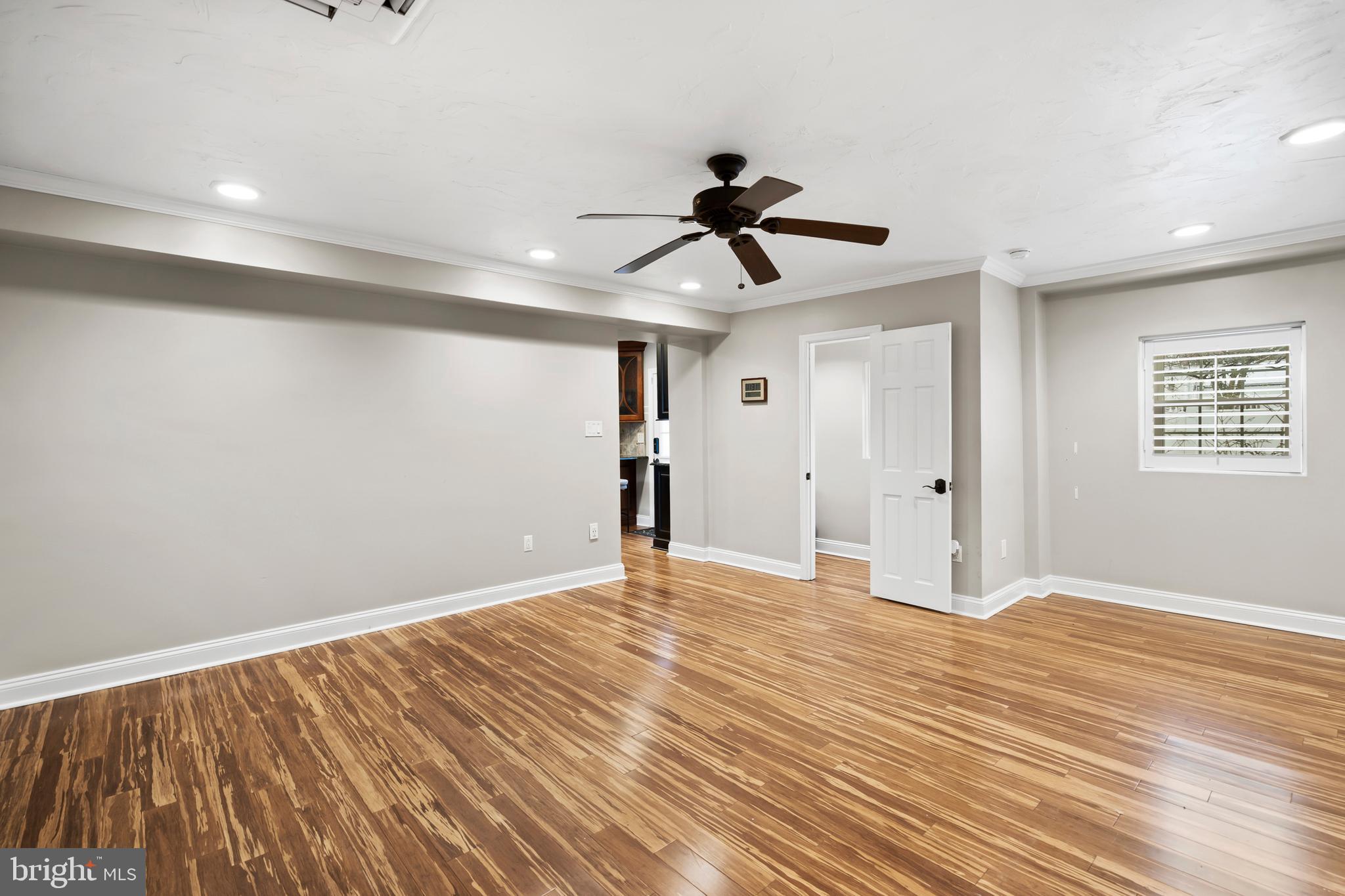 1028 Foss Avenue Drexel Hill, PA 19026 - Photo 17 of 48 a view of empty room with wooden floor and fan