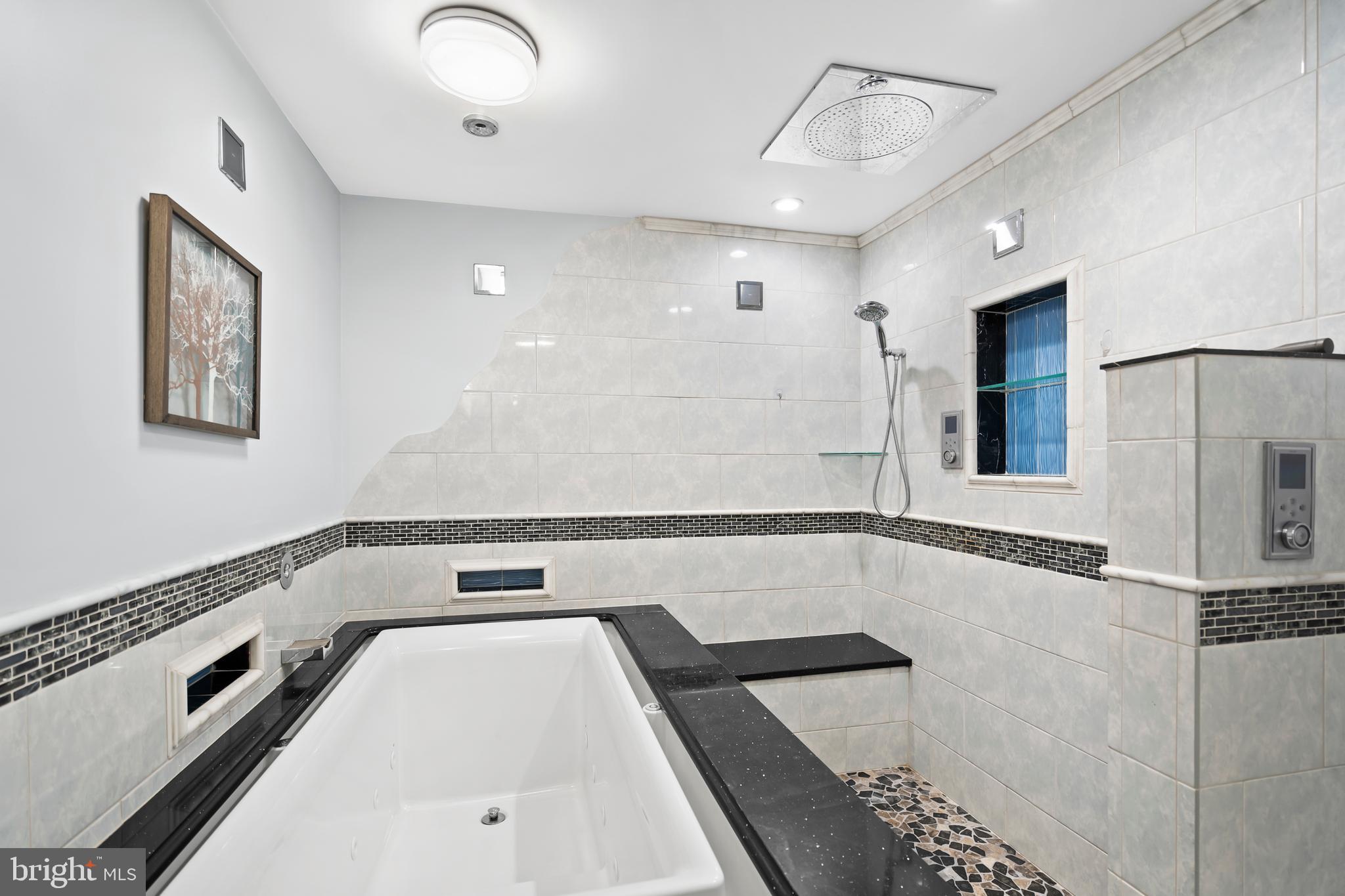 1028 Foss Avenue Drexel Hill, PA 19026 - Photo 25 of 48 a bathroom with a tub and a shower