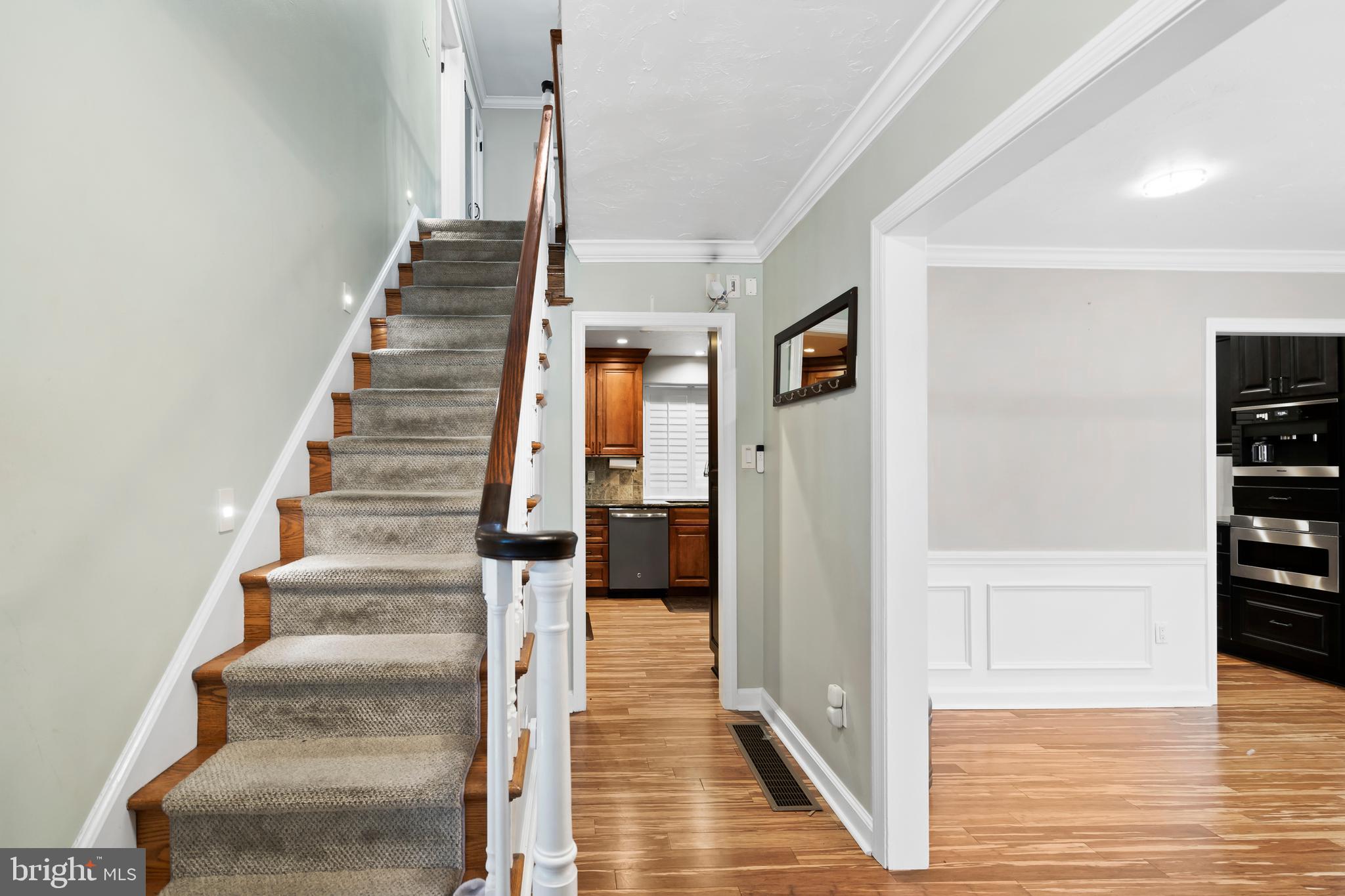 1028 Foss Avenue Drexel Hill, PA 19026 - Photo 3 of 48 a view of a hallway with wooden floor and entryway