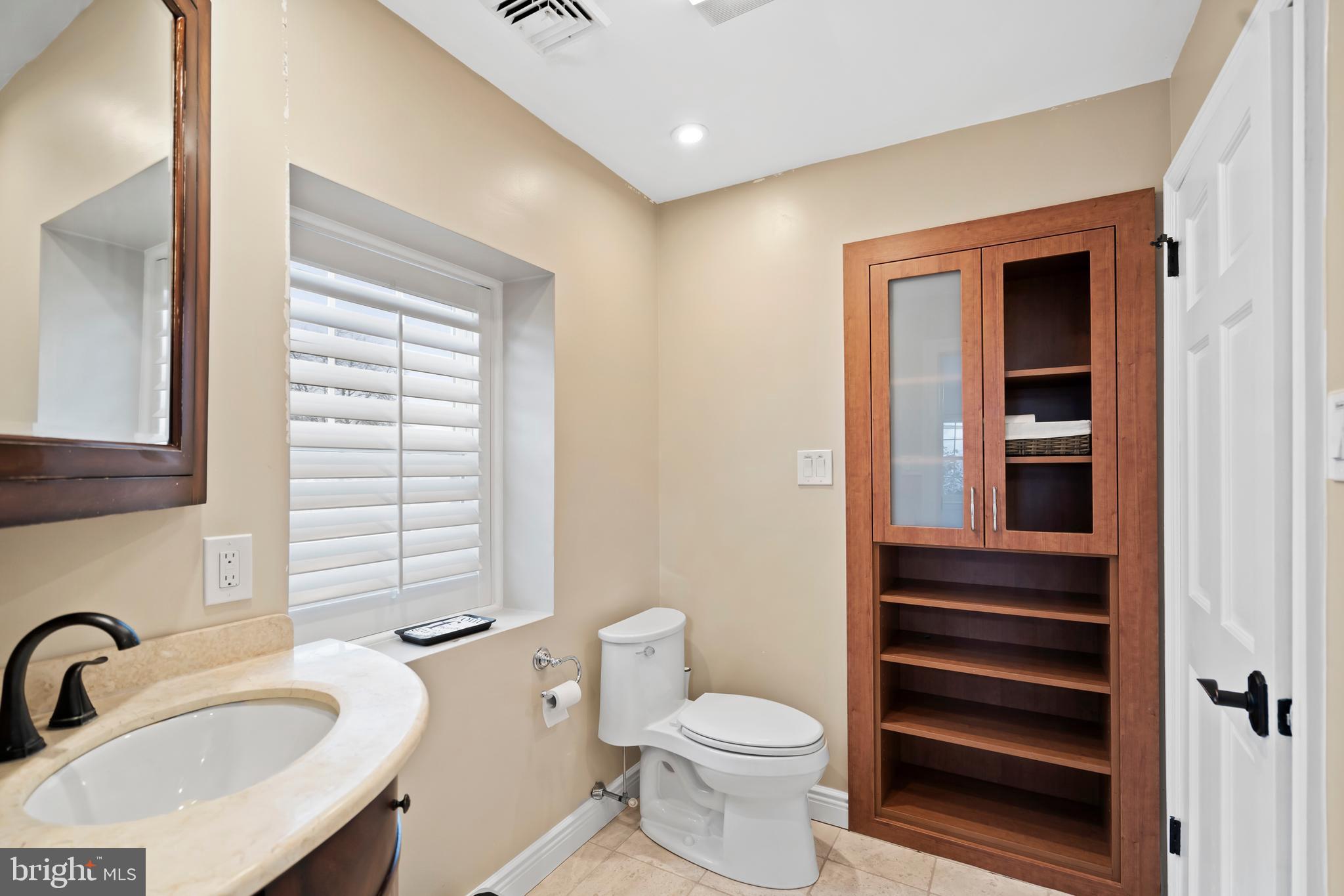 1028 Foss Avenue Drexel Hill, PA 19026 - Photo 34 of 48 a bathroom with a sink a toilet and shower