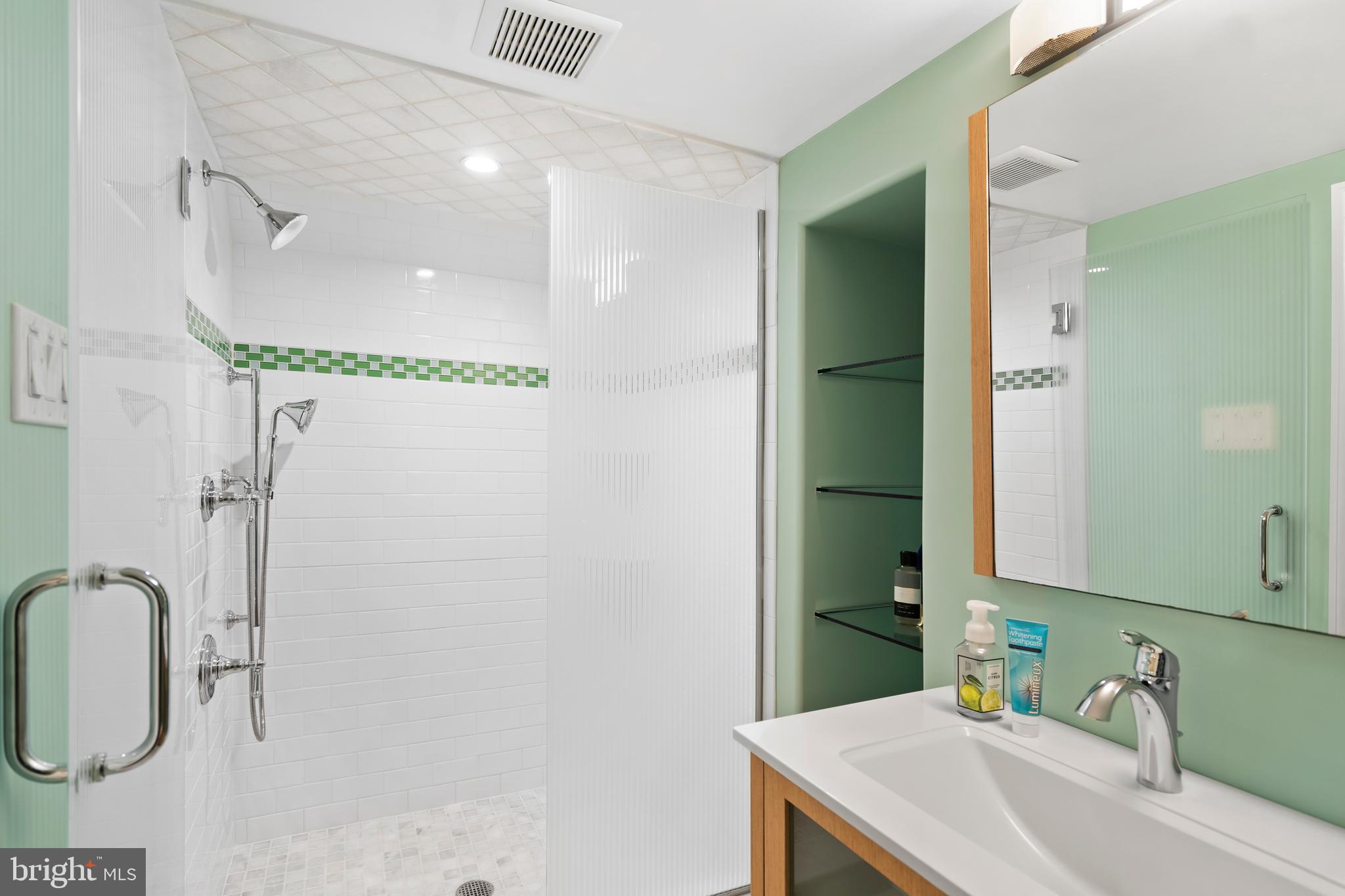 1028 Foss Avenue Drexel Hill, PA 19026 - Photo 41 of 48 a bathroom with a sink and a mirror