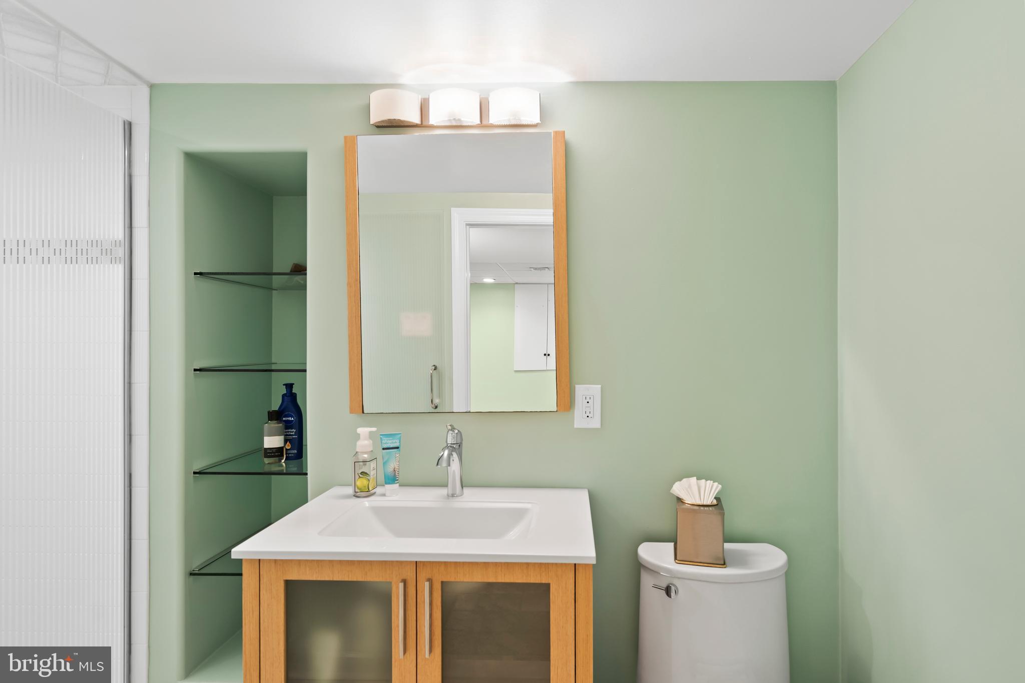 1028 Foss Avenue Drexel Hill, PA 19026 - Photo 42 of 48 a bathroom with a sink and a mirror