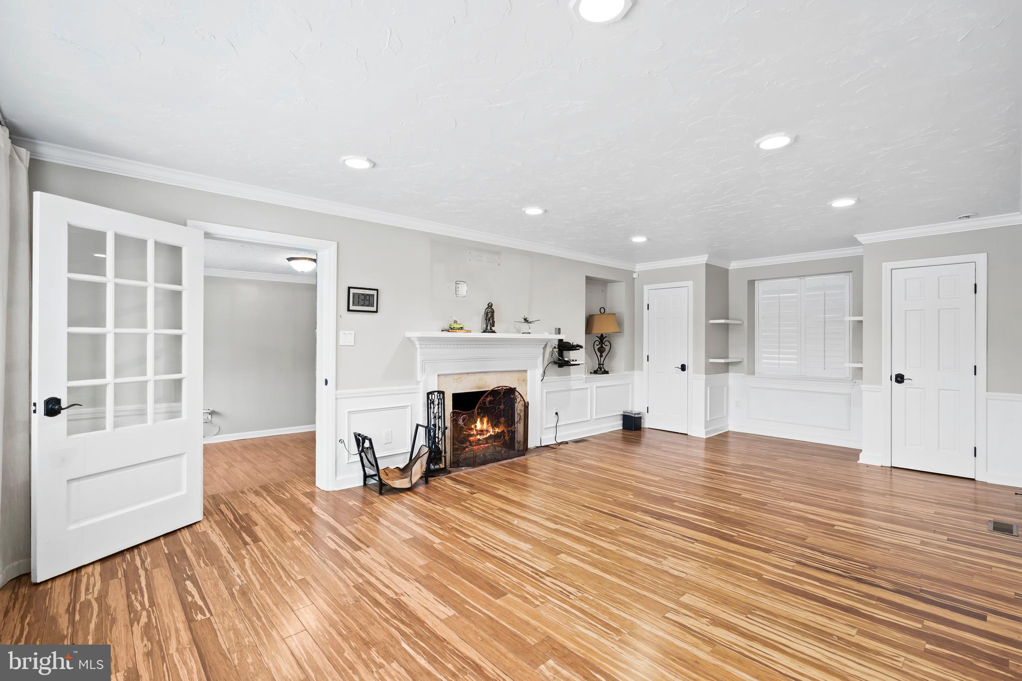 1028 Foss Avenue Drexel Hill, PA 19026 - Photo 5 of 48 a view of livingroom with a fireplace wooden floor and window