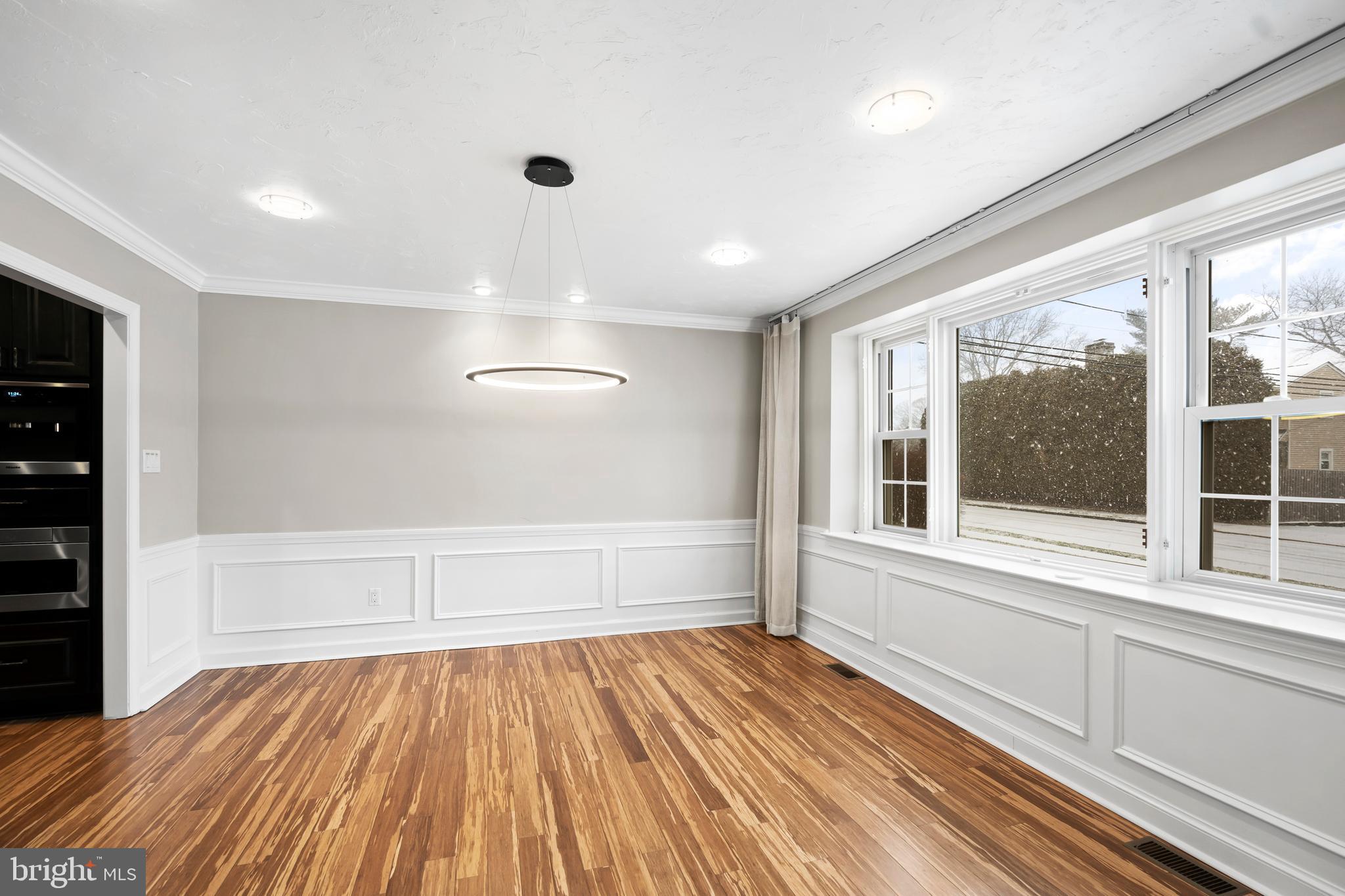 1028 Foss Avenue Drexel Hill, PA 19026 - Photo 9 of 48 a view of an empty room with wooden floor and a window