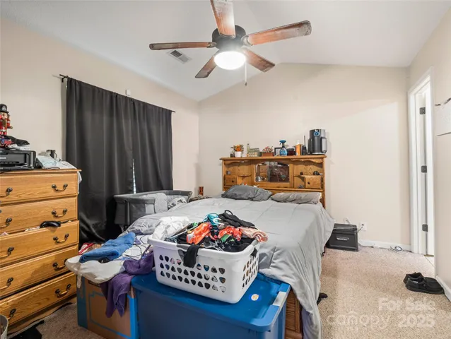 a room with furniture and a dresser