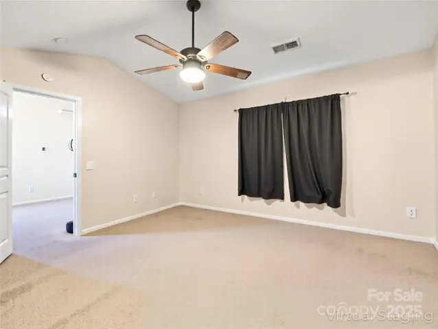 an empty room with fan