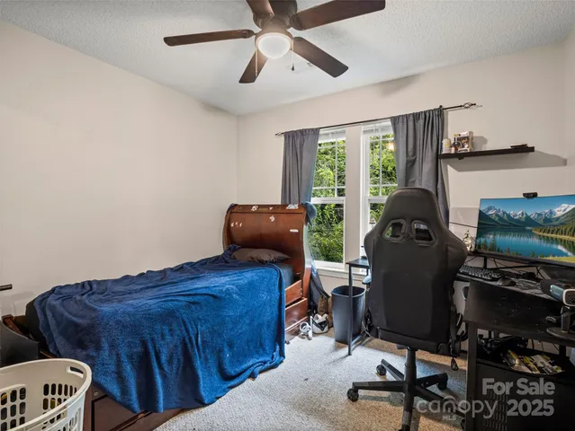 a view of workspace with furniture and windows
