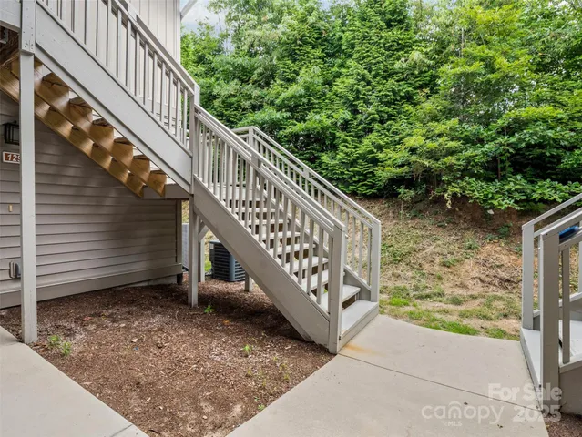 a view of balcony with wooden stairs