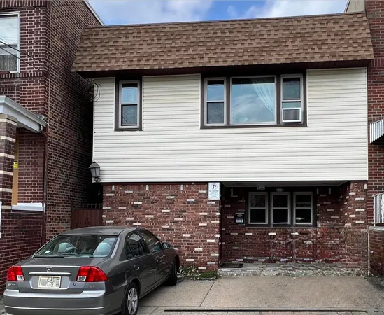 a front view of a house with parking space