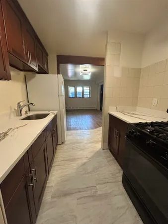 a kitchen with a sink and a stove