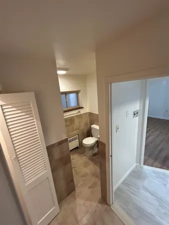 a view of a kitchen from the hallway