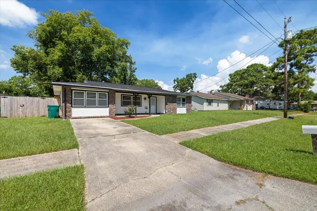 front view of a house with a yard