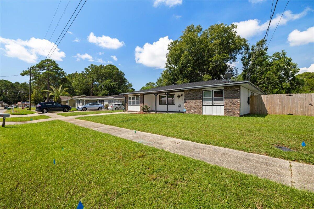 1008 Aspen Court Fort Walton Beach, FL 32547 - Photo 4 of 27 a view of house with a big yard