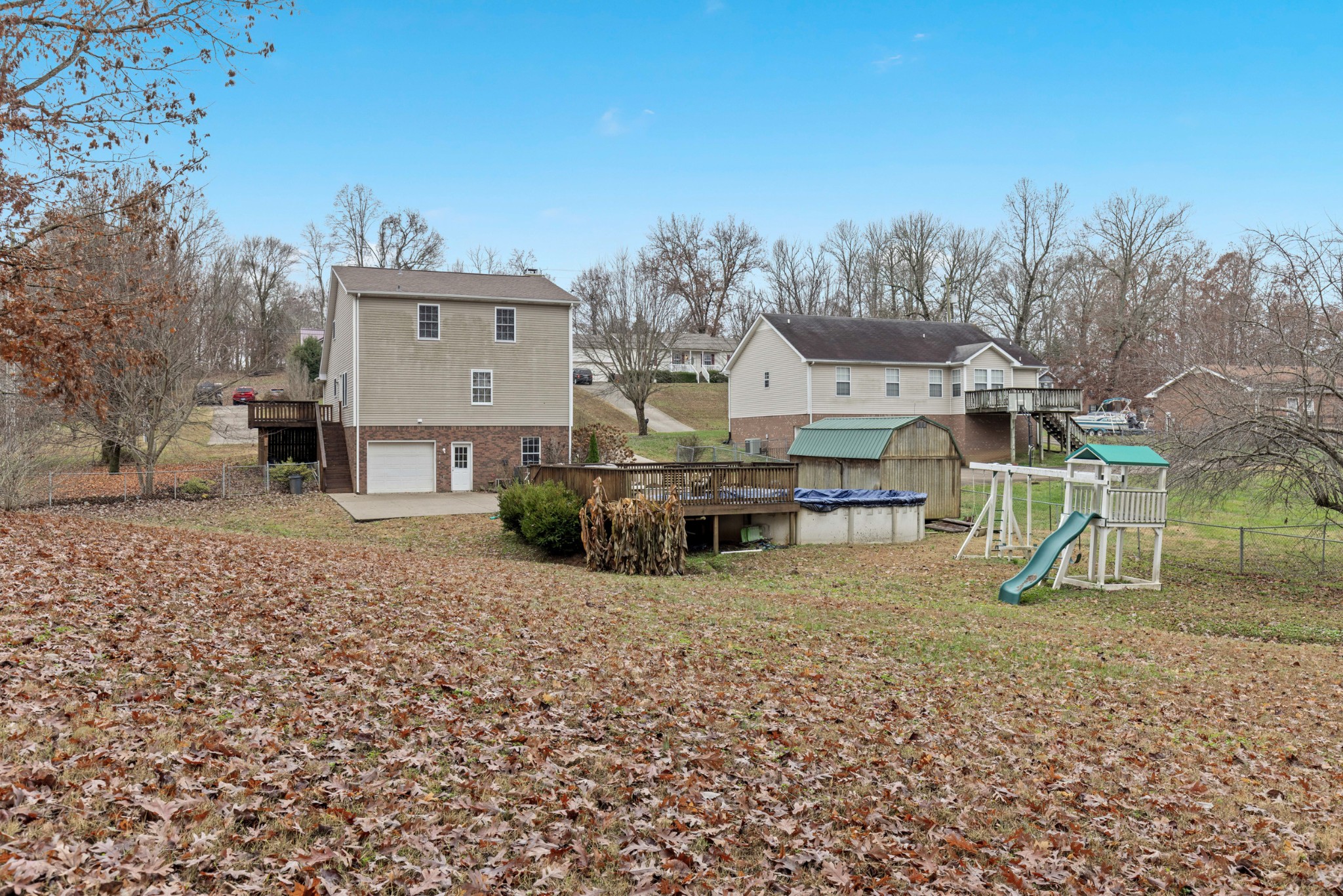 1069 Heatherwood Road Pleasant View, TN 37146 - Photo 12 of 45 a view of a house with a yard and sitting area