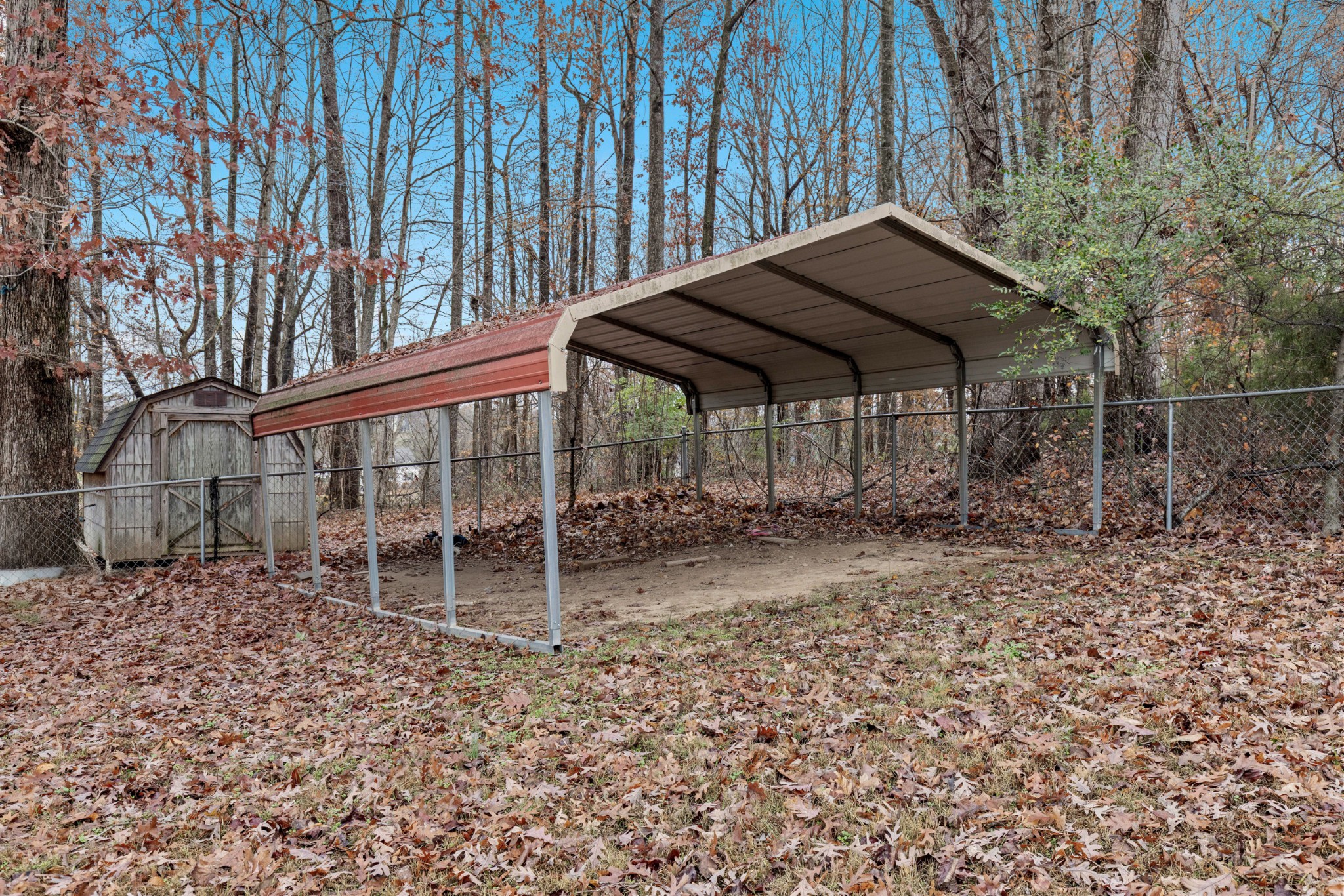 1069 Heatherwood Road Pleasant View, TN 37146 - Photo 13 of 45 a backyard of a house with table and chairs