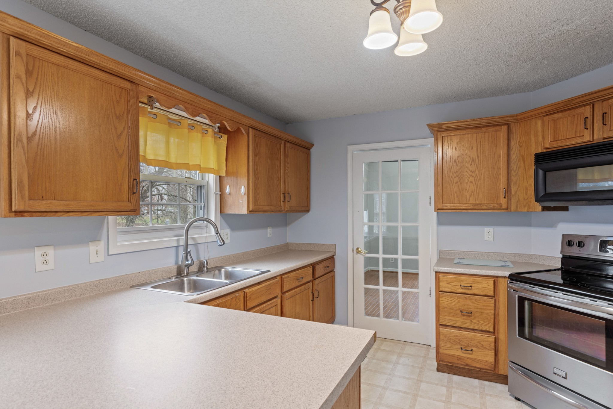 1069 Heatherwood Road Pleasant View, TN 37146 - Photo 16 of 45 a kitchen with stainless steel appliances a sink stove and cabinets