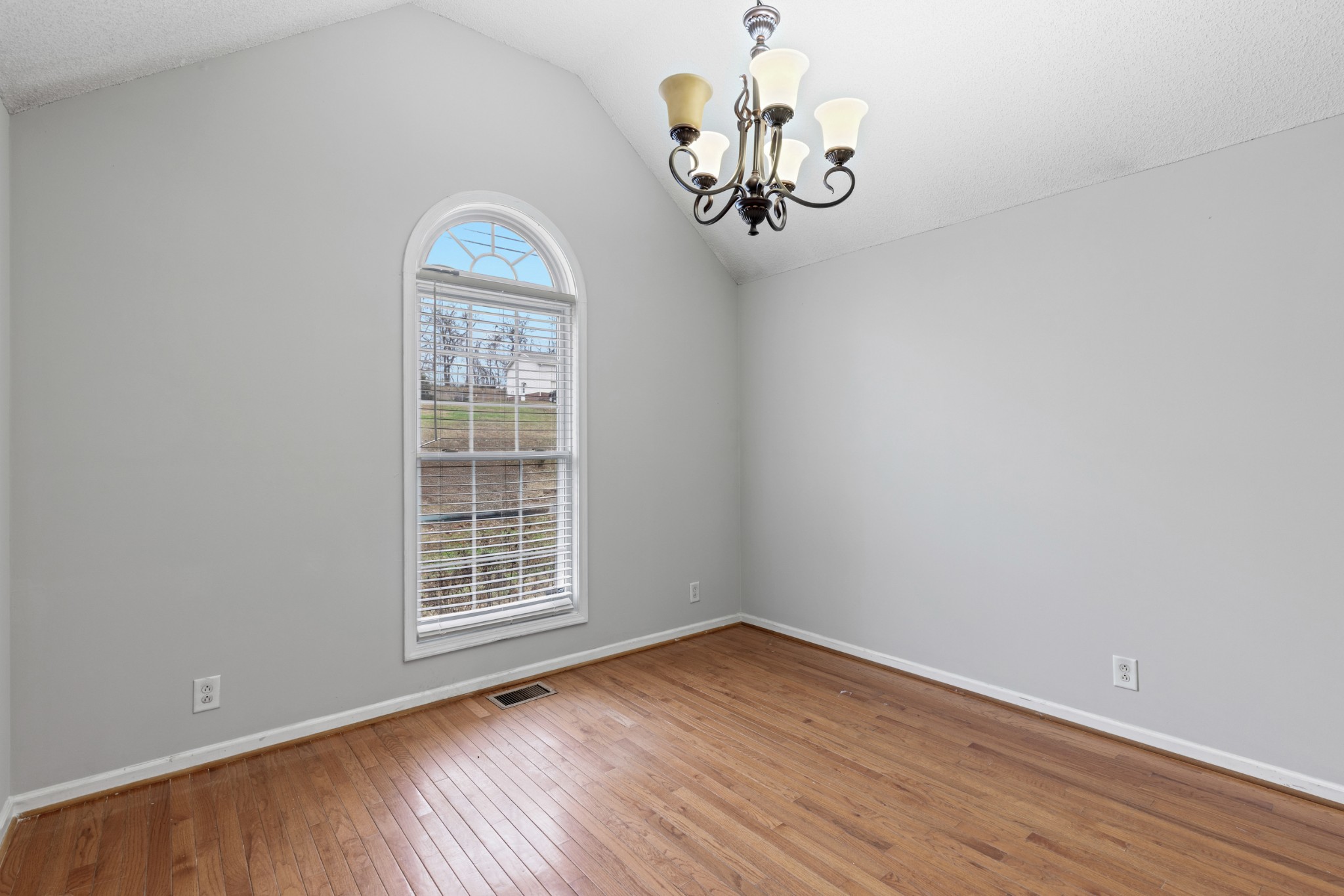 1069 Heatherwood Road Pleasant View, TN 37146 - Photo 19 of 45 a view of empty room with wooden floor and window